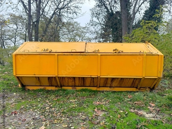 Fototapeta Large Long Yellow Dumpster outside