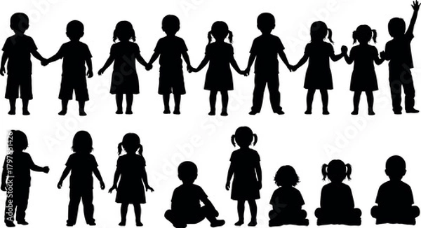 Fototapeta Diverse group of children holding hands in a line and sitting together in silhouette