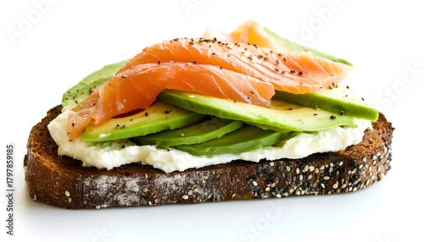 Fototapeta Rye bread slice with smoked salmon and avocado isolated on white background