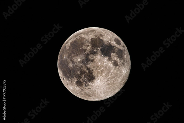 Fototapeta Warm full moon with detailed craters casting soft amber glow over pitchblack sky, inspiring romantic scenes, folklore narratives, night navigation motifs, cinematic backgrounds