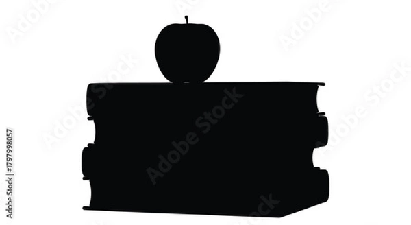 Fototapeta A silhouetted image of an apple resting on top of stacked books