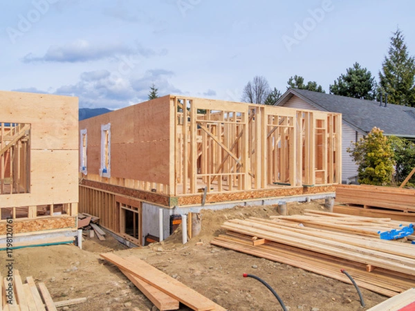Obraz Wooden frame of new building with engineered lumber materials in front