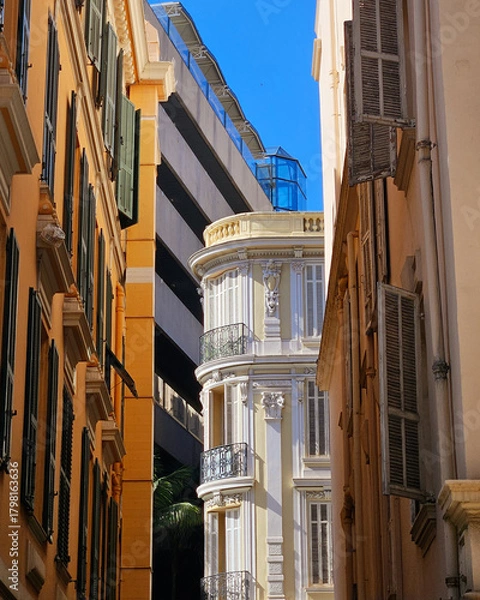 Fototapeta Architectural Contrast Between Classic Belle Époque Building and Modern High-Rise in Monaco