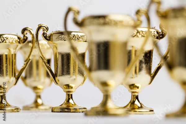 Obraz Gold winners achievement trophy background