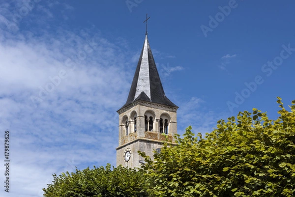 Fototapeta France, Cormatin: Steeple with tower clock, green trees and blue sky