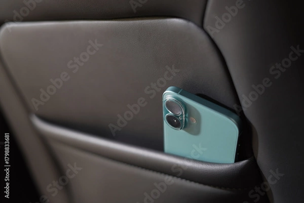 Fototapeta The phone is in the car.