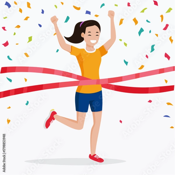 Obraz A happy woman runner crossing the finish line with arms raised in victory and confetti falling around her.
