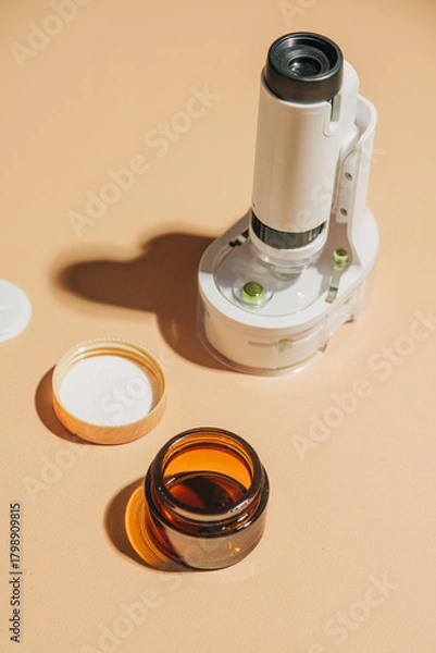 Obraz Cosmetic containers with miniature microscope arrangement
