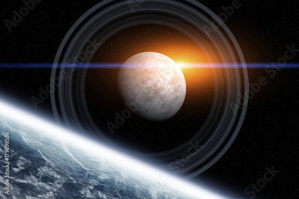 Fototapeta View of a sunrise on a distant ring planet system in space