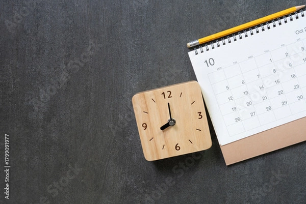 Fototapeta close up of calendar on the black table background, planning for business meeting or travel planning concept