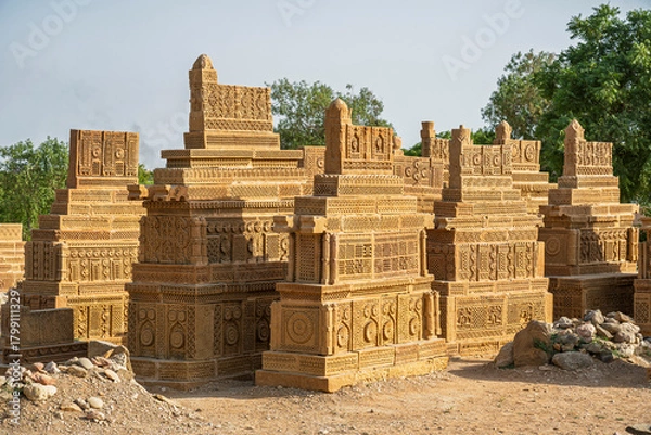 Obraz Landscape view of group of ancient carved golden sandstone islamic tombs in Chaukhandi cemetery, Karachi, Sindh, Pakistan