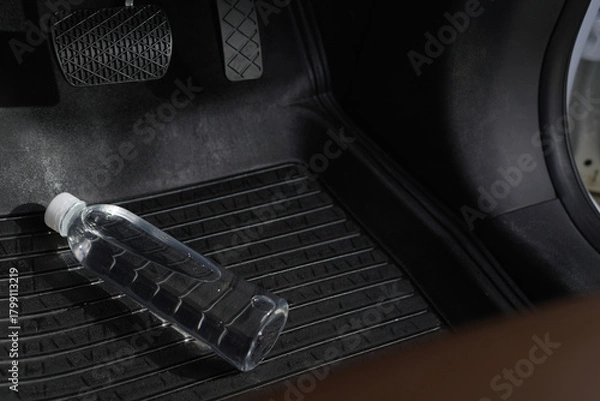 Fototapeta Drinking water in the car prepared for traveling