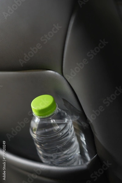 Obraz Drinking water in the car prepared for traveling