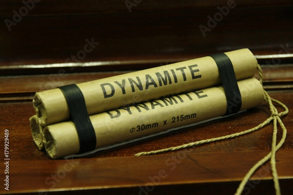 Obraz Dynamite stick isolated on wooden table
