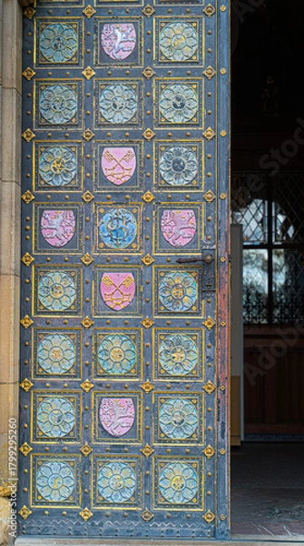 Obraz Metal doorway of the Basilica of St Peter and St Paul in Vysehrad fortress Prague Czech Republic decorated with the coat of arms of Bohemia and whole Czech lands