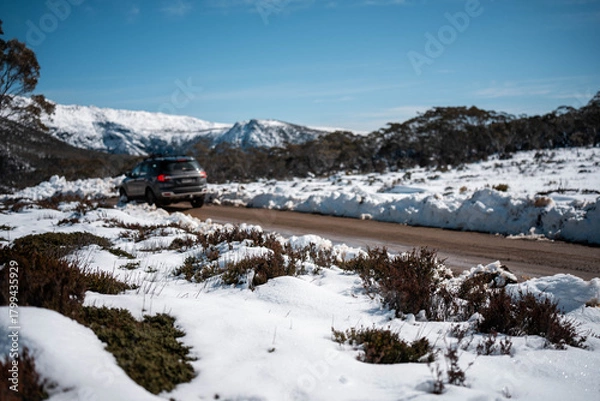 Obraz Ice on the road on a mountain in winter in australia mountain in a national park looking over a city below, mt wellington hobart tasmania australia in summer. snow on the roads.