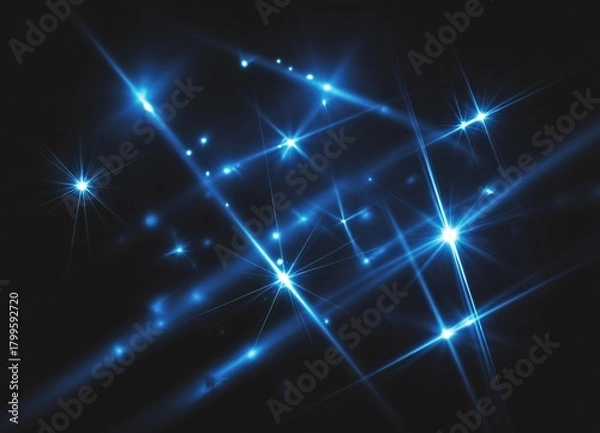 Obraz Experience the thrill of dynamic blue starbursts illuminating the night sky, perfect for adding a touch of modern magic to your next project or design.