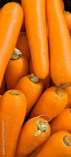 Obraz Carrots in orange vegetable shop for background