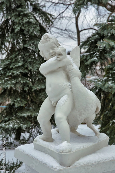 Fototapeta Winter statue of child with goose