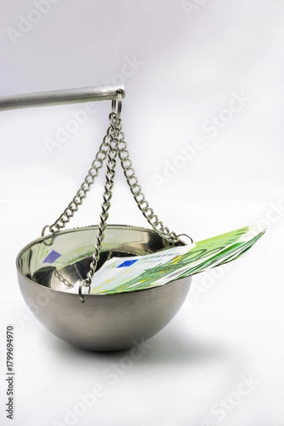 Fototapeta 100 Euro banknotes on balance scale symbolizing financial justice concept.