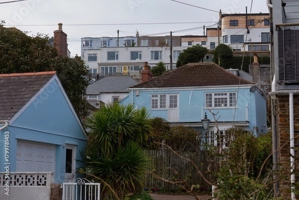 Fototapeta Residential neighborhood with several houses. The houses are of varying sizes and colors, with some having gardens in Perranporth - Cornwall - UK