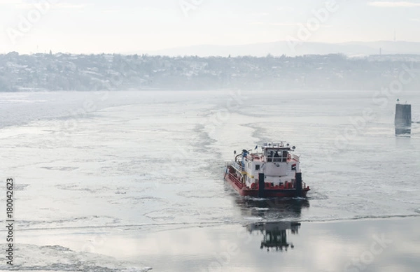 Fototapeta Icebreaker on the frozen Danube River 