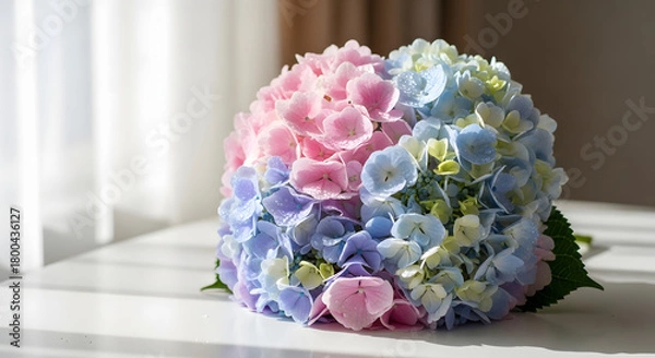 Fototapeta Heart-Shaped Hydrangea Bouquet on White Table in Soft Sunlight