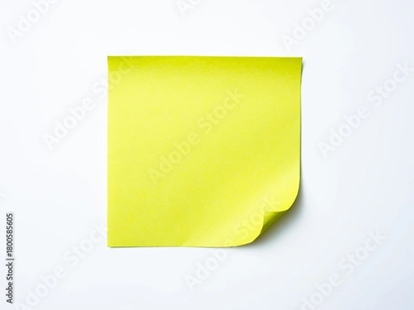 Obraz Single yellow sticky note with curled corner placed on a clean white background.