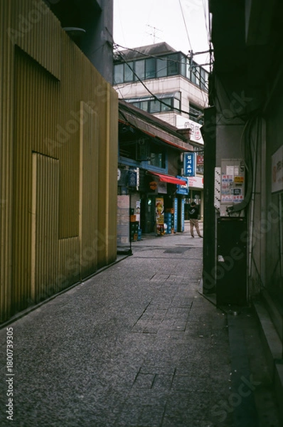 Fototapeta Narrow Alley Leading to Shopping Street in Myeongdong, Seoul