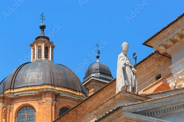 Fototapeta Urbino, Italy - August 9, 2017: The Cathedral. Piazza Duca Federico. Sculpture and statue in architecture.