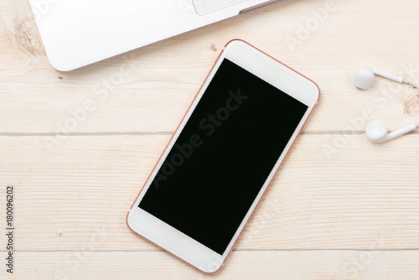 Obraz Smartphone mock up template on office deck.