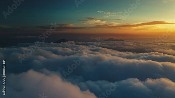 Fototapeta Cloud scape above carpathian mountains shot at sunset