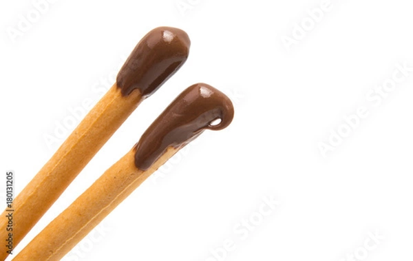 Fototapeta Biscuit sticks in chocolate isolated