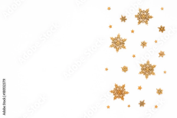 Fototapeta Golden christmas snowflake on white background, flat lay, top view, christmas pattern