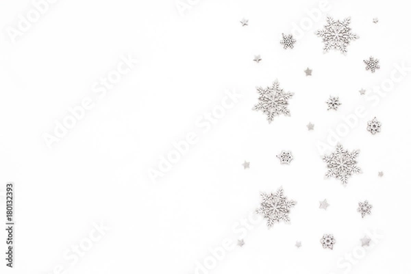 Fototapeta Silver christmas snowflake on white background, flat lay, top view, christmas pattern
