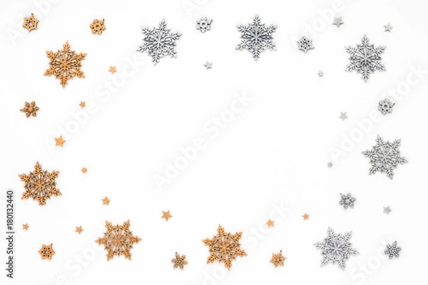 Fototapeta Golden and silver christmas snowflake on white background, flat lay, top view, christmas frame