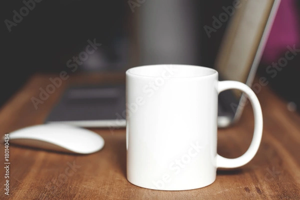 Obraz White mug on the desktop