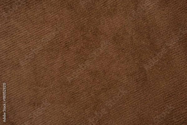 Fototapeta Corduroy fabric. Fabric texture. Stylish and comfortable casual corduroy pants laid out on a flat surface against a white background. Ideal for fashion blogs, textiles, apparel, and advertising