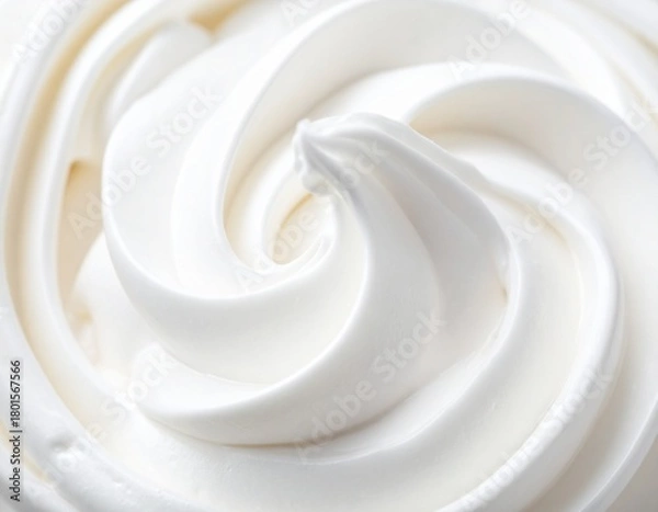 Fototapeta Macro photograph of a creamy, swirling white texture, resembling soft-serve ice cream or whipped cream