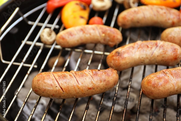 Obraz Sausages on barbecue grill