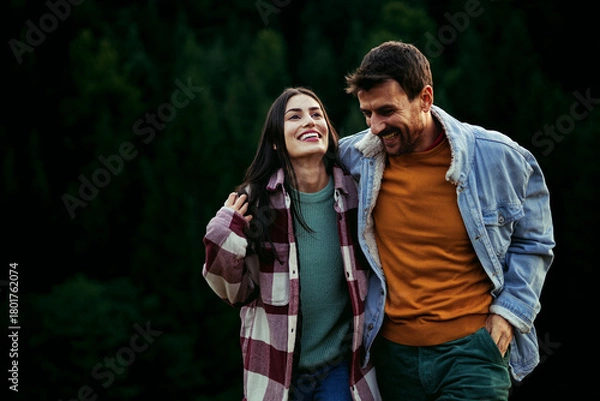 Obraz Happy couple walking, laughing, enjoying a romantic relationship