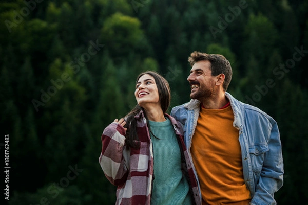 Obraz Happy couple enjoying nature smiling in forest