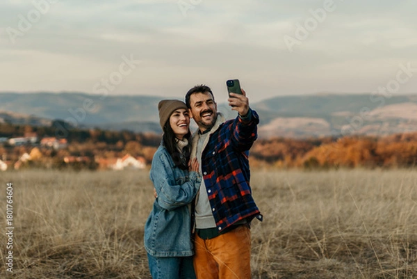 Obraz Happy couple taking selfie enjoying autumn nature
