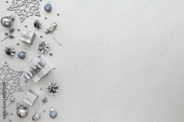 Obraz Monochrome Holiday pattern with gift boxes and New Year decoration, snowflakes on silver background. Total silver design, Christmas card, Minimal style. Flat lay