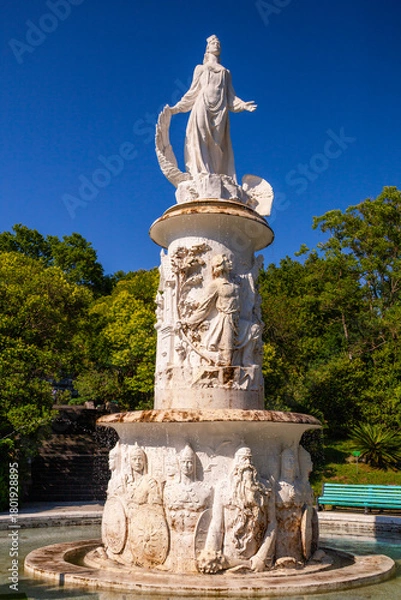 Fototapeta Sochi, Russia - July 04, 2020: Skazka Fountain in the Sochi Arboretum park of unique subtropical flora and fauna in Sochi resort city in Krasnodar Krai, Russia, vertical photo