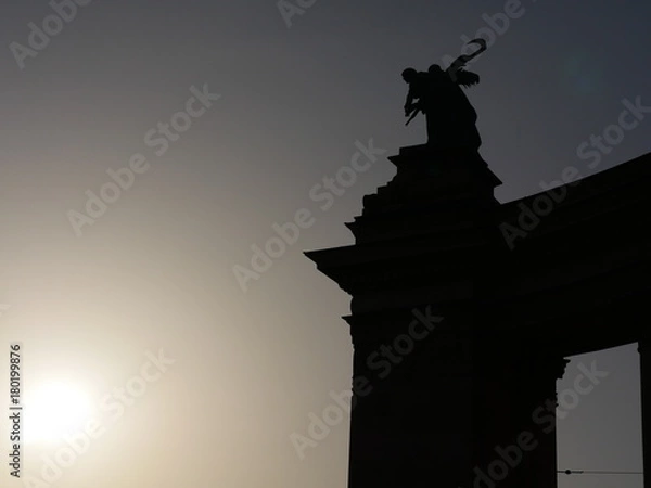 Fototapeta statue sunset