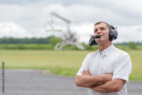 Obraz mature man wearing headset at airfeild