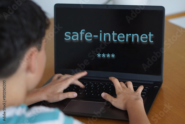 Fototapeta safe internet concept. teenager typing a password on their laptop