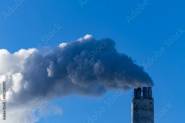 Obraz Stockholm, Sweden Steam coming out of a power plant smokestack on a cold day in winter.