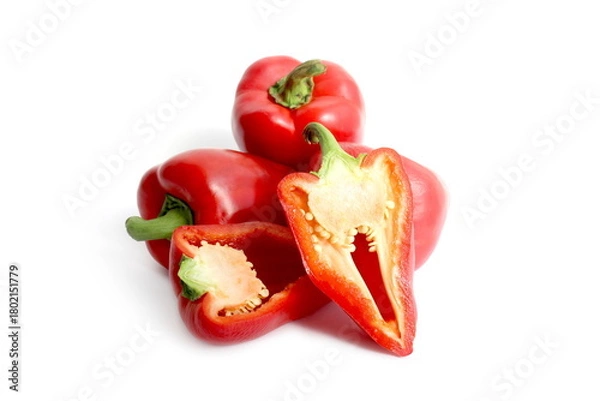 Fototapeta There is a pile of red sweet peppers lying on a white background.